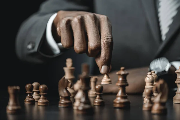 African american businessman playing chess — Stock Photo