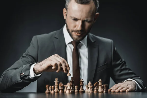 Pensive businessman and chess — Stock Photo