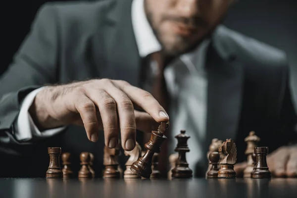 Businessman playing chess — Stock Photo