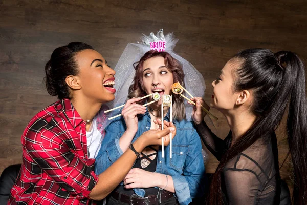 Multicultural women with sushi at hen party — Stock Photo