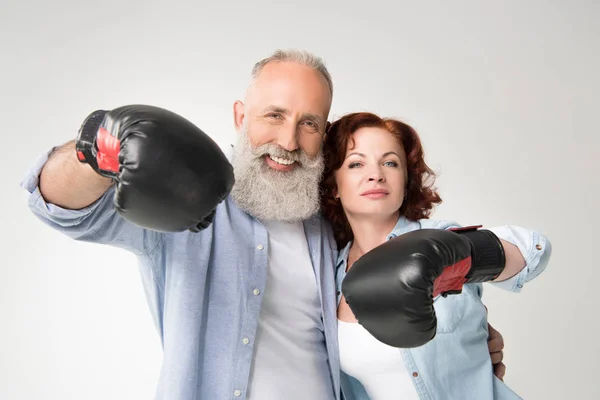 Mature couple in boxing gloves — Stock Photo