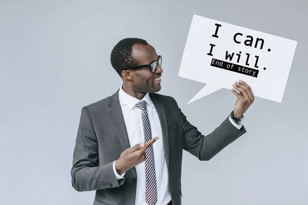 African american businessman with blank card — Stock Photo