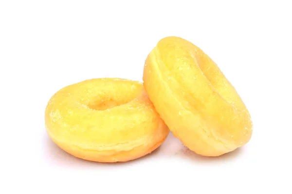 Leckere Donuts bedeckt von Zucker isoliert auf weißem Hintergrund — Stockfoto