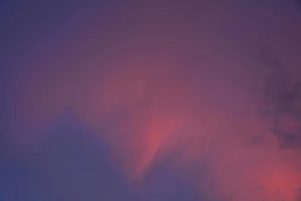 Orange fluffy clouds in the dark blue sky — Stock Photo, Image