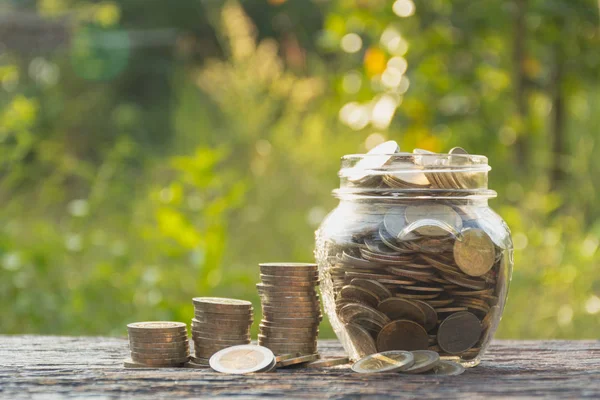 Coins in jar with money stack step growing money, Concept finance business and saving investment. — Stock Photo, Image