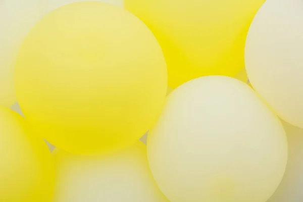 Close up of bunches and groups of yellow helium balloons. — Stock Photo, Image