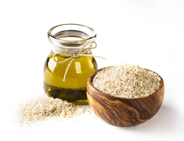 Sesame oil and seeds — Stock Photo, Image