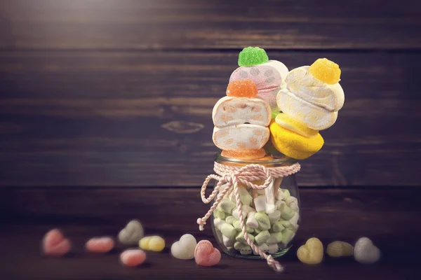 Marshmallow sticks in a small glass — Stock Photo, Image