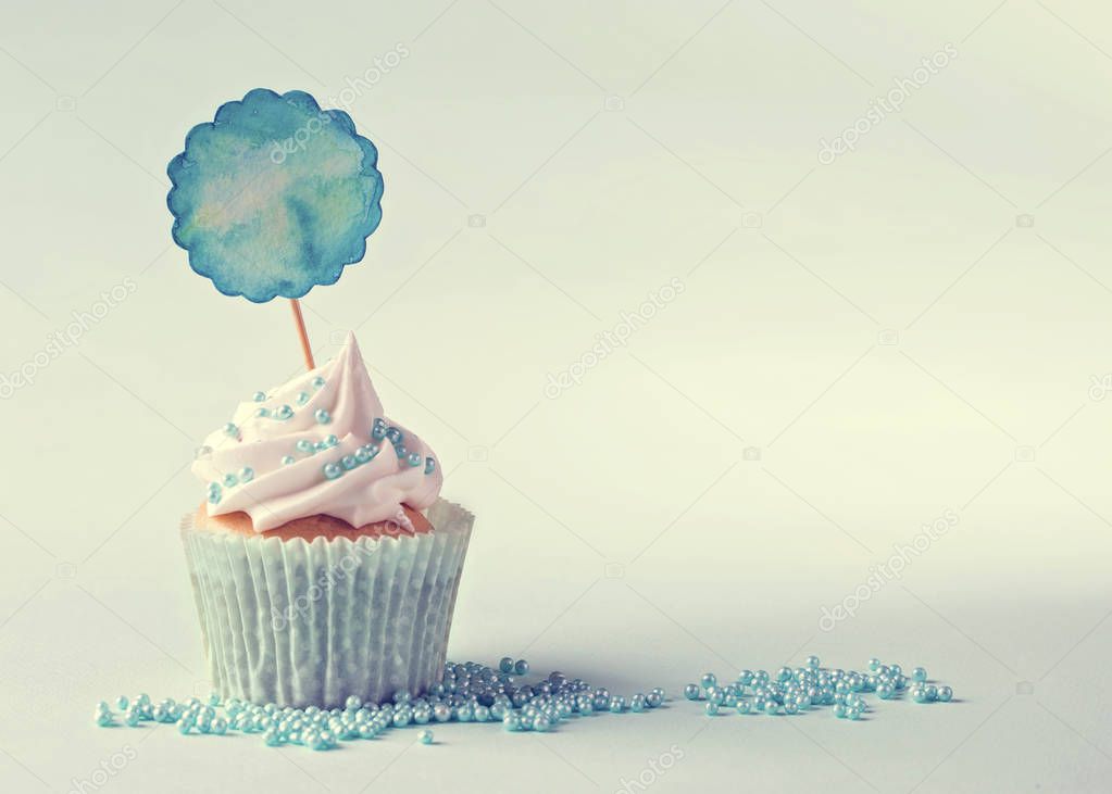 Cupcake with a blue pick 