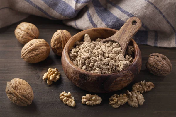 Walnut flour in the wooden bowl — Stock Photo, Image