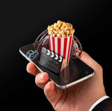 Smartphone Uygulama online satın alma ve sinema biletleri rezervasyon. Canlı film ve video izlemek. Patlamış mısır, sinema reel, tek kullanımlık Kupası, tokmağı ve smarthone bilet alışılmadık 3d çizimi