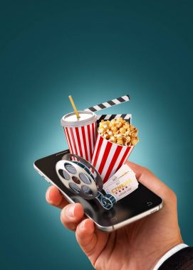 Smartphone Uygulama online satın alma ve sinema biletleri rezervasyon. Canlı film ve video izlemek. Patlamış mısır, sinema reel, tek kullanımlık Kupası, tokmağı ve smarthone bilet alışılmadık 3d çizimi