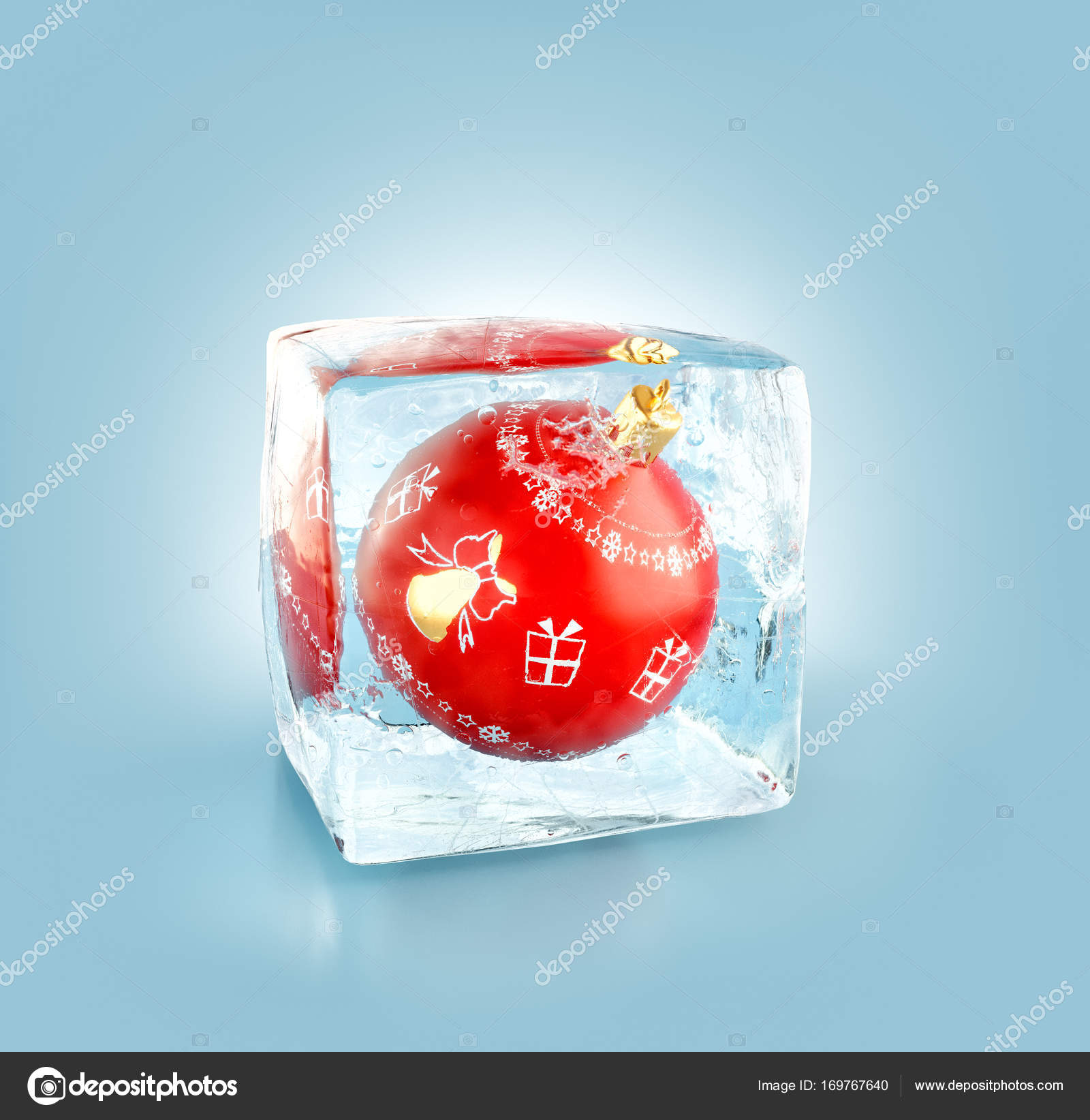 Beautiful red Christmas ball inside ice cube. Stock Photo by