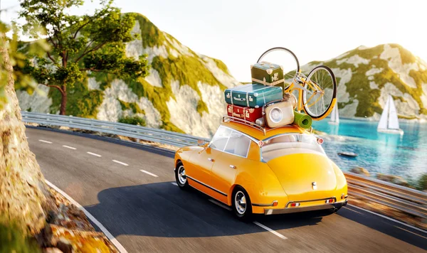 Cute little retro car with suitcases and bicycle on top goes by the road along beautiful harbor between mountain in summer day. — Stock Photo, Image