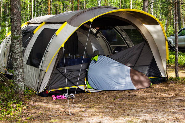 a large tent in the woods
