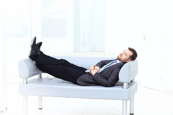 Satisfied businessman relaxing in his office — Stock Photo, Image