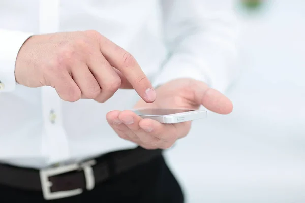 Mock up of a man holding device and touching screen — Stock Photo, Image