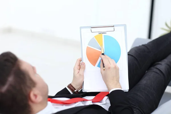 Businessman is reading documentation — Stock Photo, Image