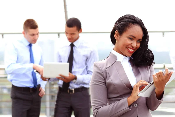 Group of business people with businessman leader on foreground — Stock Photo, Image