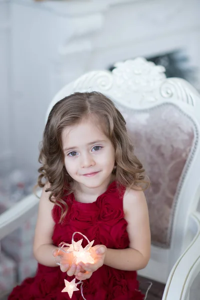 Girl with Christmas shiny stars — Stock Photo, Image