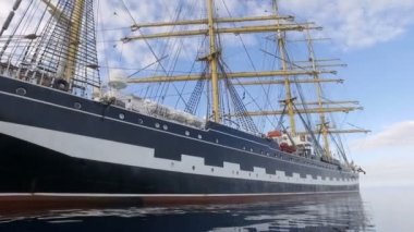 Aegean Sea - OCTOBER 2016. Russian Training Sailing Ship. Old Four-Masted Barque In The Calm Mirror-Smooth Sea On The Background Of The Mountain Coast.