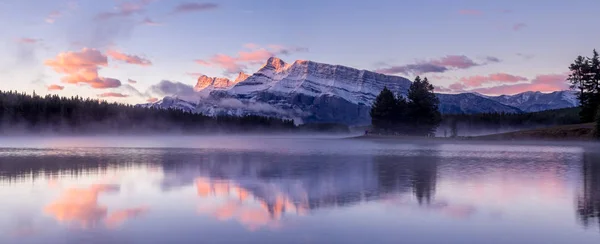 Rundle Mountain reflecting in Two Jack Lake