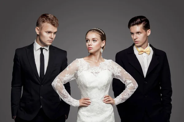 Two handsome men and beautiful bride, studio — Stock Photo, Image