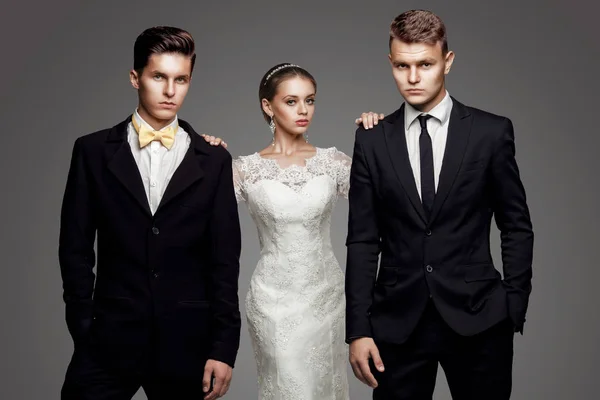 Two handsome men and beautiful bride, studio — Stock Photo, Image