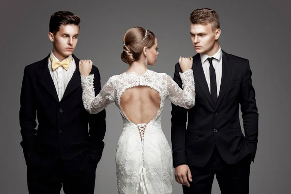 Two handsome men and beautiful bride, studio — Stock Photo, Image