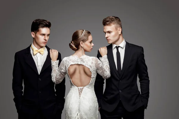 Two handsome men and beautiful bride, studio — Stock Photo, Image