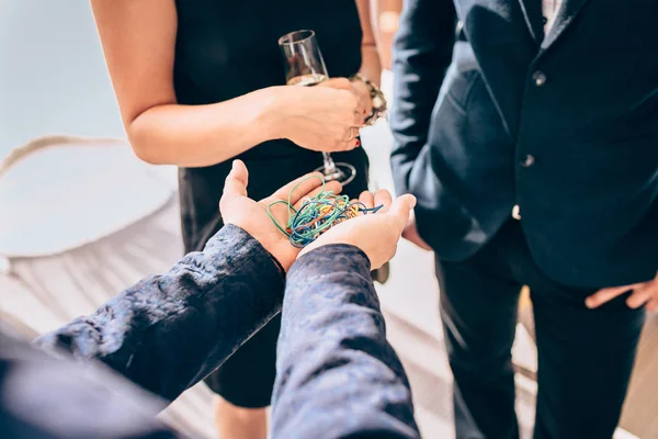 Master of ceremonies holding rubbers in his hands — Stock Photo, Image