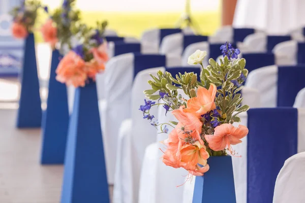 Beautifuly decorated with white and blue cloth and flowers chairs — Stock Photo, Image