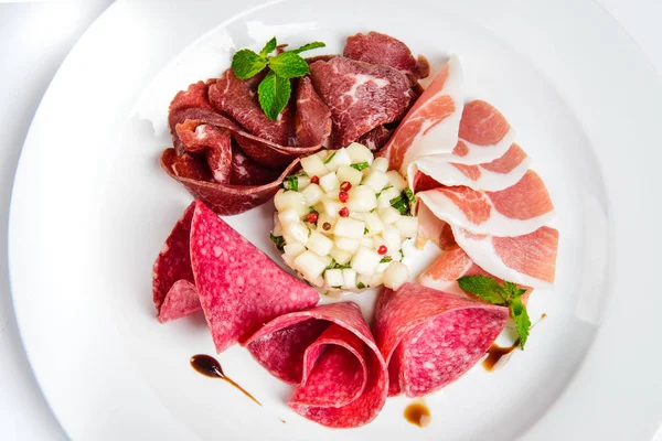 Dish of various types of meat-cutting on plate. — Stock Photo, Image