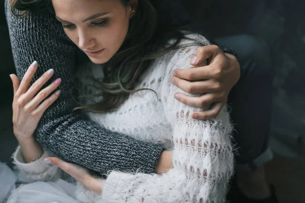 Unrecognizable man hugs his beautiful woman. Sensitive couple in love. Close-up portrait. — Stock Photo, Image