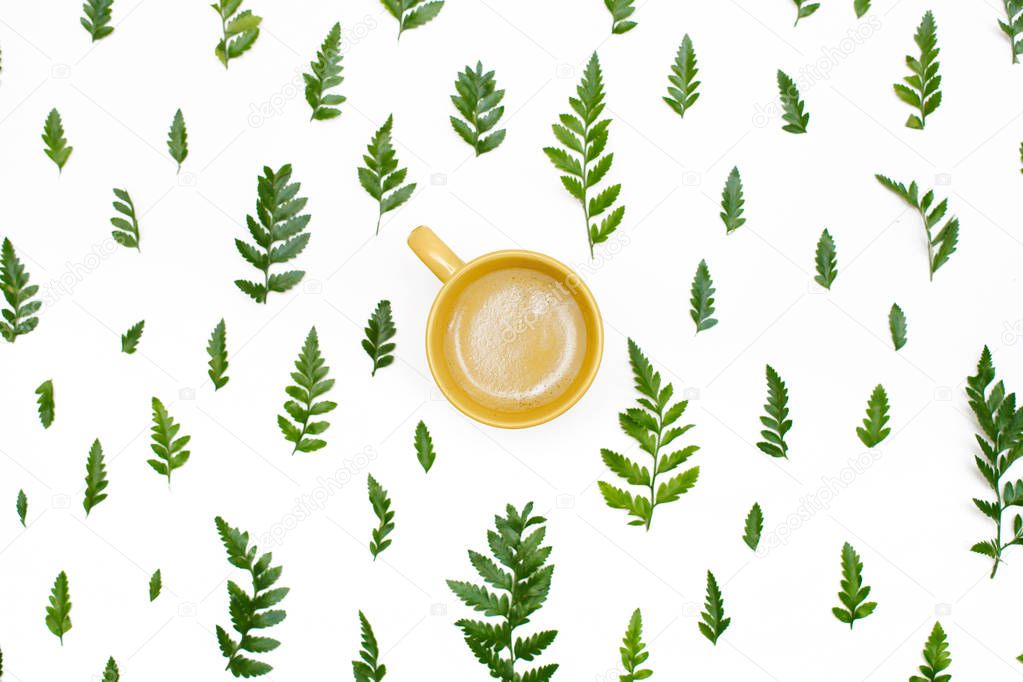 pattern with green leaves and a cup