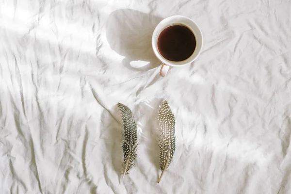 Cup Coffee Feathers Cotton Sheet Flat Lay Top View — Stock Photo, Image