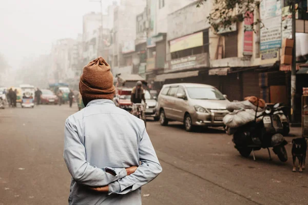 Old man walking on Delhi street