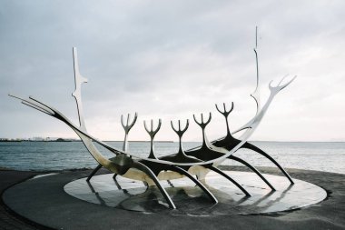 Reykjavik, Iceland-May 5 2018: a modern sculpture Solar (The Sun Voyager) in the bay by Jn Gunnar rnason clipart