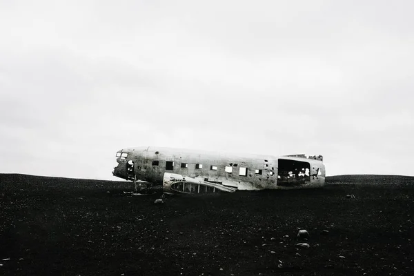 The famous wrecked abandoned Dc-3 airplane on a black sand beach in Iceland