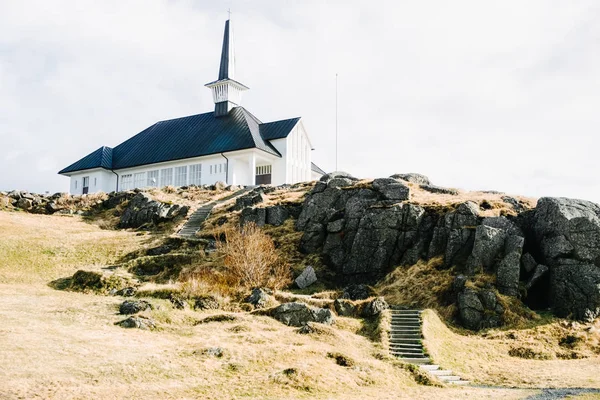 Lonely old wooden church on a hill in Iceland.
