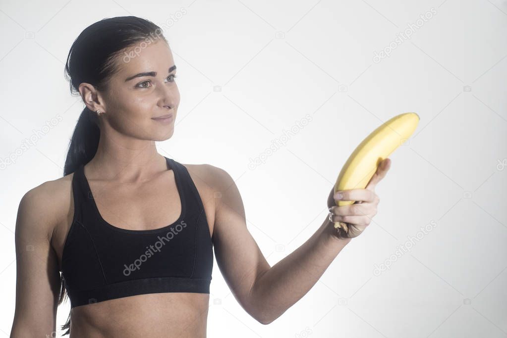 Beautiful girl. The girl is holding an banana.