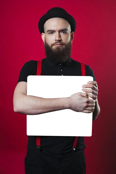 Bearded guy holding empty paper