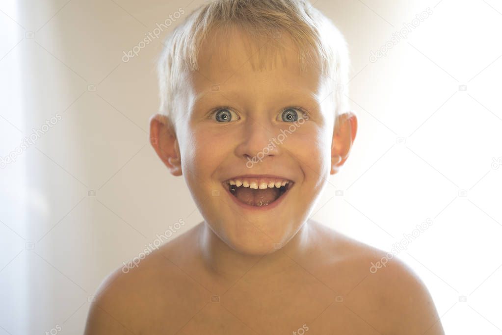 Portrait of a little boy on a white background