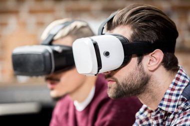 Men in virtual reality glasses