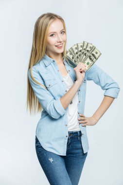Woman holding dollar banknotes   clipart