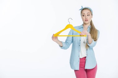 Woman holding hanger