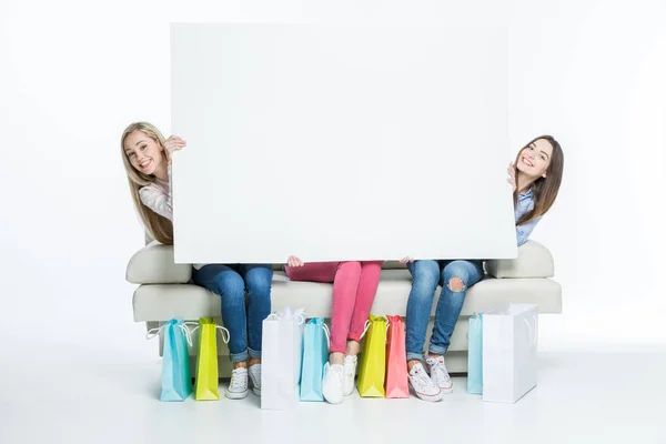 Mujeres con tarjeta en blanco — Foto de Stock