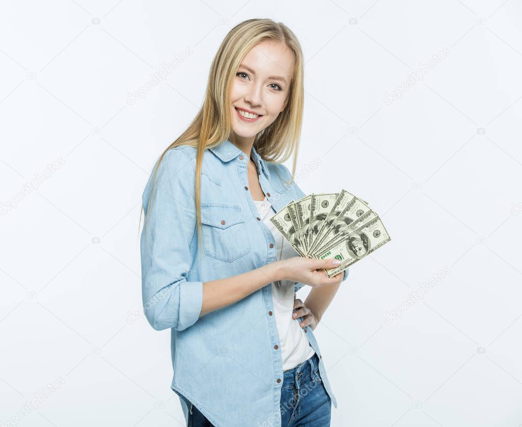 Woman holding dollar banknotes 