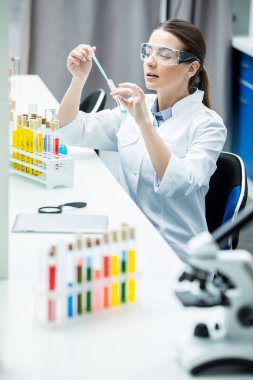 Female scientist in lab clipart