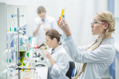 Female scientist in lab clipart